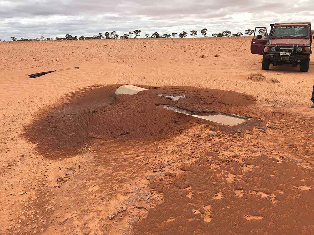 A water trough in a paddock on the Lambert’s property at Meringur after a fierce windstorm on 19 February 2020.